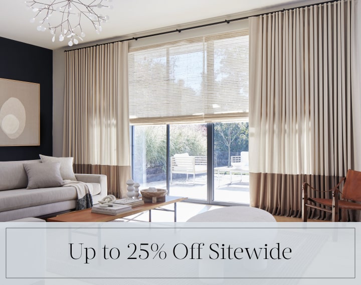 Up to 25% Off Sitewide in black text over an image of windows with Woven Wood Shades and Drapery.