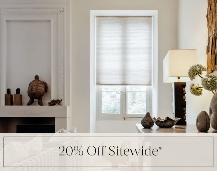 20% Off Sitewide in black text over an image of a window with light filtering Cellular Shades.
