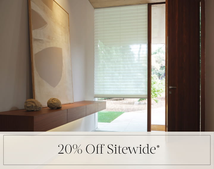 20% Off Sitewide in black text over an image of a window with a light filtering Pleated Shade.