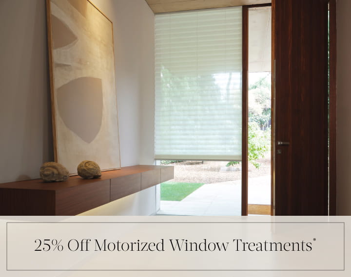 25% Off Motorized Window Treatments in black text over an image of a window with a light filtering Pleated Shade.