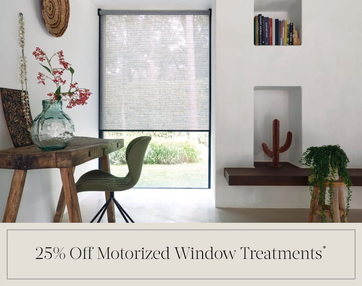 25% Off Motorized Window Treatments in black text over an image of an office window with grey roller shades.