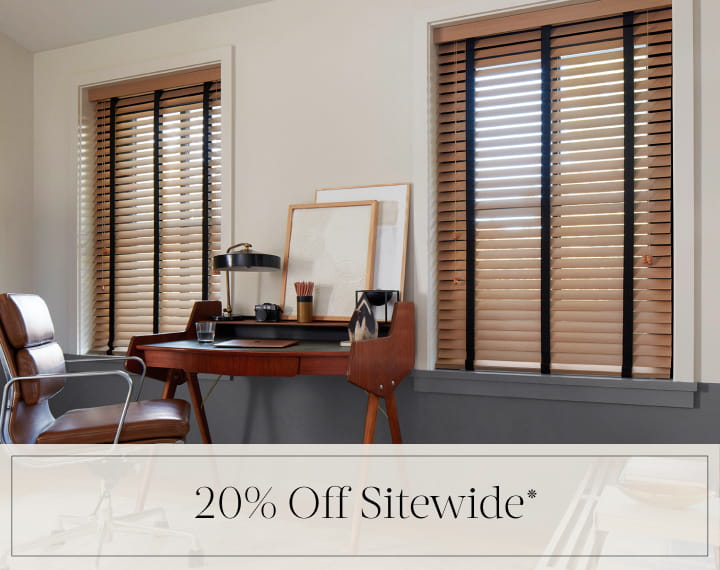 20% Off Sitewide in black text over an image of office windows dressed with Oak Wood Blinds.